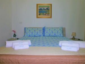 Säng eller sängar i ett rum på Casa Vacanze Triscele