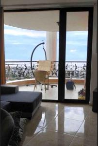 a living room with a view of the ocean at Amazing apartment facing the sea in Burgas City