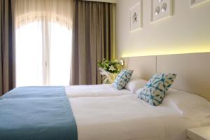 Ein Bett oder Betten in einem Zimmer der Unterkunft Aldiana Club Costa del Sol