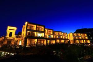 a lit up building at night with at Costa Farilya Special Class Hotel Bodrum in Gundogan