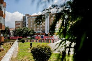 a building with a playground in a park at Cozy 3 Room Apartment in Penafiel Centre in Penafiel