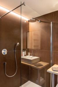 a bathroom with a shower and a sink at B&B Hof Beygaert in Aalst