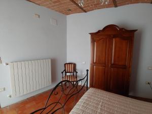 Postel nebo postele na pokoji v ubytování Castello di Fagnano -Albergo Diffuso & SPA