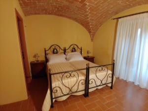 Postel nebo postele na pokoji v ubytování Castello di Fagnano -Albergo Diffuso & SPA