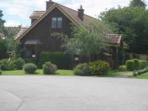 a house with a driveway in front of it at Sunflower Bed & Breakfast in Findhorn