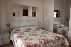 A bed or beds in a room at VIALE REPUBBLICA 307 2