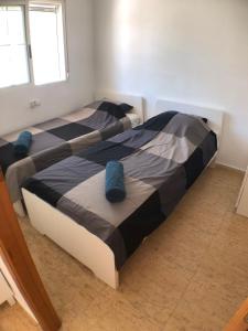 Ένα ή περισσότερα κρεβάτια σε δωμάτιο στο Casa Vromans Bajo