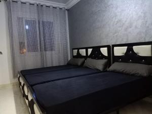 Postel nebo postele na pokoji v ubytování apartement 5 residence oulad touimi