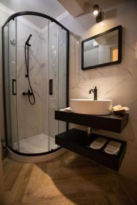 a bathroom with a sink and a shower at AL 54 Accommodation in San Benedetto del Tronto