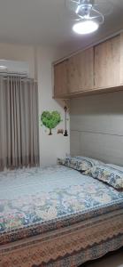a bedroom with a large bed with avertisement at Mar Azul in Solemar +73 photos