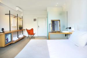 Posteľ alebo postele v izbe v ubytovaní Basilico Suites Adults Only by Estia
