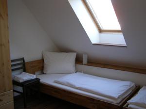 En eller flere senge i et værelse på Hotel Alt Vinnhorst