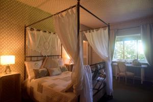 Кровать или кровати в номере Villa Ottolenghi Wedekind