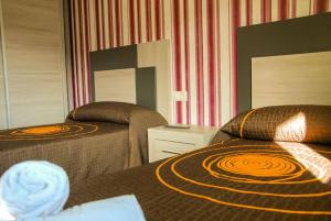 Posteľ alebo postele v izbe v ubytovaní Apartamentos Loncho Finisterre