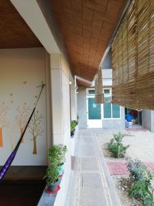 a hallway of a building with potted plants at Casa Puerto Bonito & Private Coworking in Puerto Escondido