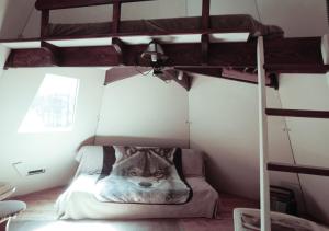 a bedroom with a wolf mural on the wall at Aux Tipis de la Rivière Sauvage in Saint Romain