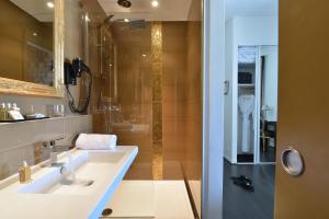 a bathroom with a sink and a shower at Hôtel La Villa Cannes in Cannes