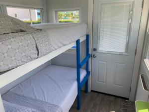a bunk bed in a tiny house at Tiny House Siesta in Sarasota