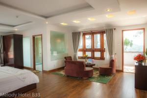 Postel nebo postele na pokoji v ubytování Melody Hotel