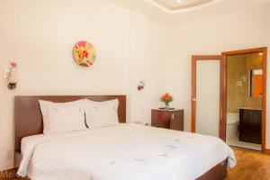 Postel nebo postele na pokoji v ubytování Melody Hotel