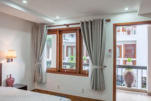 Postel nebo postele na pokoji v ubytování Melody Hotel