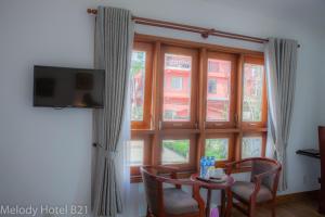TV a/nebo společenská místnost v ubytování Melody Hotel