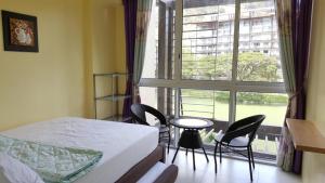 Postel nebo postele na pokoji v ubytování Creys Condo 2 at Pico de Loro Cove + 37 fotografií