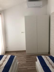 Postel nebo postele na pokoji v ubytování Ideal Holiday Apartment 2