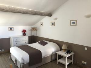 Postel nebo postele na pokoji v ubytování Le Couvent