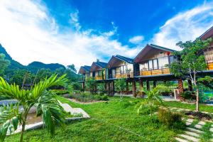 a resort with mountains in the background at Phong Nha Bolero Bungalow in Phong Nha