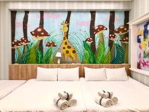 a bedroom with a mural of a giraffe and mushrooms at Kaohsiung Time's in Kaohsiung
