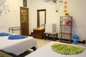 Postel nebo postele na pokoji v ubytování Sigiri Saman Home Stay