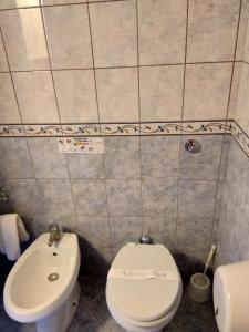 a bathroom with a toilet and a sink at Case Vacanze Ancora in Porto Empedocle