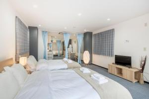 Postel nebo postele na pokoji v ubytování Uhome Ueno Apartment 4