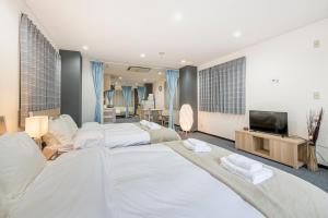 Postel nebo postele na pokoji v ubytování Uhome Ueno Apartment 4