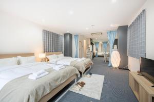 Postel nebo postele na pokoji v ubytování Uhome Ueno Apartment 4