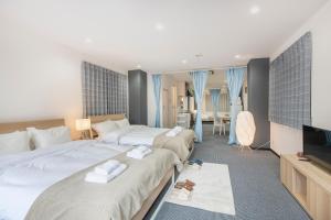 Postel nebo postele na pokoji v ubytování Uhome Ueno Apartment 4