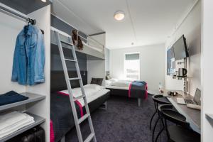 Cabinn Copenhagen客房内的一张或多张床位