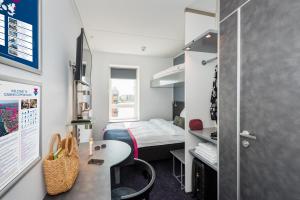 Cabinn Copenhagen客房内的一张或多张床位