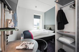 Cabinn Copenhagen客房内的一张或多张床位