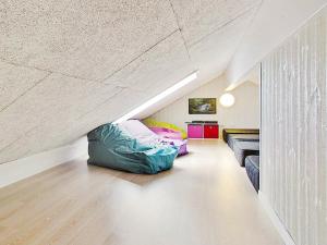a attic room with two bean bags on the floor at 18 person holiday home in Liseleje in Liseleje