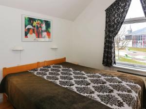 En eller flere senge i et værelse på Apartment Hadsund