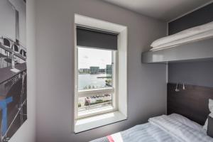 Cabinn Copenhagen客房内的一张或多张床位