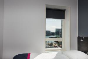 Cabinn Copenhagen客房内的一张或多张床位