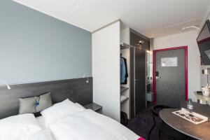 Cabinn Copenhagen客房内的一张或多张床位