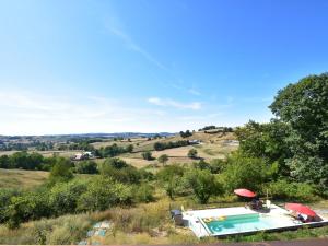 a house with a swimming pool in a field at Splendid Mansion in Cuzy with Swimming Pool in Cuzy