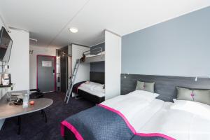 Cabinn Copenhagen客房内的一张或多张床位