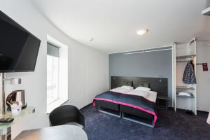 Cabinn Copenhagen客房内的一张或多张床位