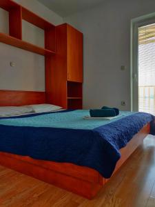 Кровать или кровати в номере Apartments Jerkovic