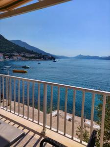 a view of the ocean from a balcony at Apartments Jerkovic in Klek